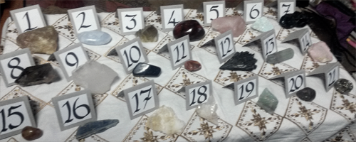 Crystal Divination Readings - crystals laid out on a table with corresponding numbers